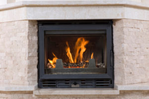 White brick mantel with black fireplace insert