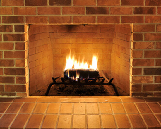 lit brick fireplace